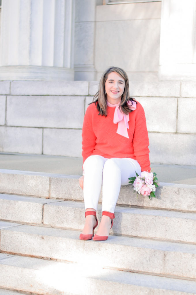 valentine's Day outfit for teacher_red sweater_pink bow top_white ankle pants_festive classroom outfit